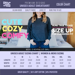 May include: Unisex adult sweatshirt sizing chart with measurements in inches for length, width, and sleeve. The chart includes sizes S, M, L, XL, 2XL, 3XL, 4XL, and 5XL. The text "Runs true to size. Size up for oversized fit" is also included.