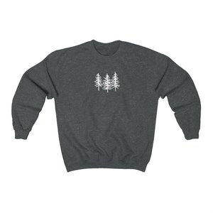 May include: A dark grey sweatshirt with a white outline of three pine trees on the front.