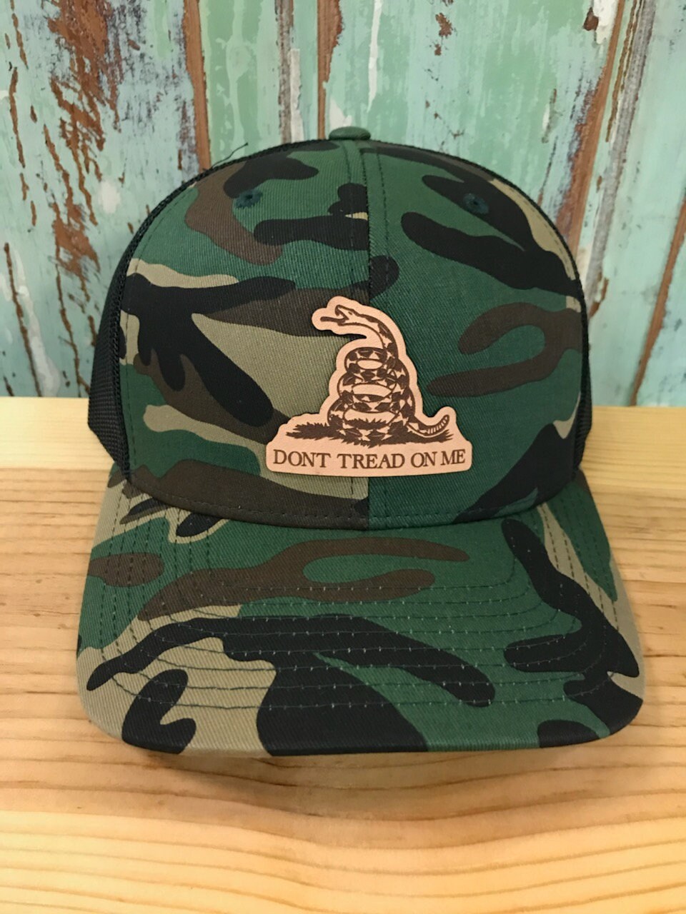 Don't Tread on Me Outline Leather Patch Trucker Hat Camo/black