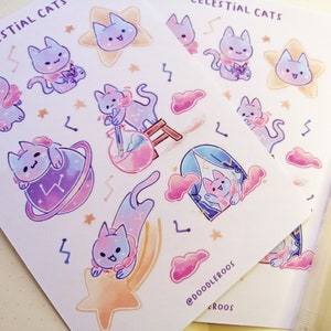 May include: A sheet of stickers featuring cute cartoon cats with celestial themes. The stickers are printed on white paper and feature a variety of designs, including cats in space, cats with stars, and cats with clouds. The stickers are perfect for adding a touch of whimsy to your planner, laptop, or water bottle.