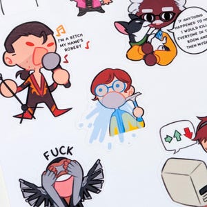 Puede incluir: Una hoja de pegatinas coloridas con personajes de dibujos animados en varias poses. Una pegatina tiene el texto "I'M A BITCH MY NAME'S ROBERT". Otra pegatina tiene la palabra "FUCK". Las pegatinas están sobre un fondo blanco.