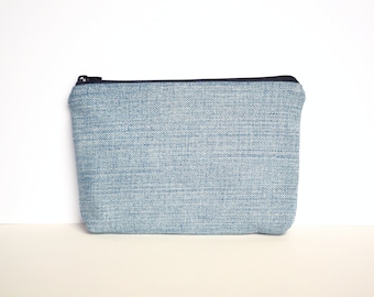 upcycled denim pouch with black zipper and dark blue lining, eco-friendly recycled vegan purse, zero waste sustainable small makeup bag