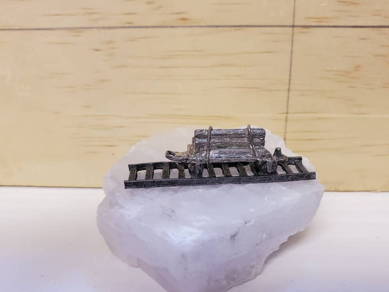 Pewter Railcar on top of Calcite Crystal