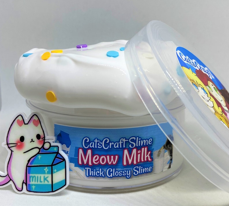 May include: White slime with colorful sprinkles in a clear plastic container with a lid. The container has a label that says "CatsCraft Slime Meow Milk Thick Glossy Slime".