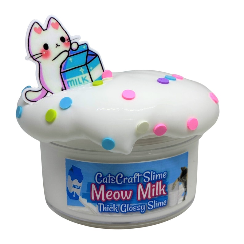 May include: White slime with colorful sprinkles in a clear jar with a white cat cartoon holding a carton of milk on top. The jar has a label that reads "CatsCraft Slime Meow Milk Thick Glossy Slime".