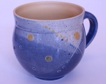 Cup with polka dot pattern