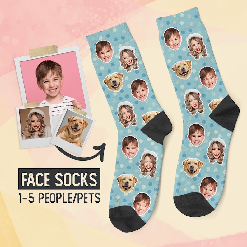 May include: A pair of blue socks with white polka dots. The socks feature a repeating pattern of faces, including children and a dog. The text "FACE SOCKS 1-5 PEOPLE/PETS" is printed on the image.