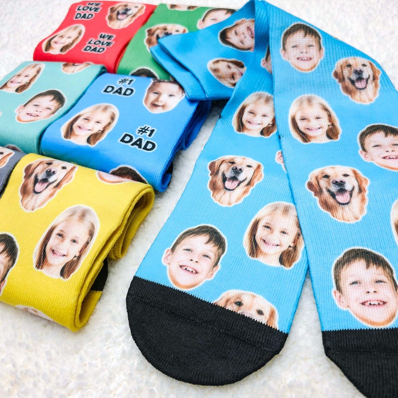 May include: A set of colorful socks with different designs. The socks feature images of people and dogs. The socks are made of a soft, comfortable material and are perfect for everyday wear.