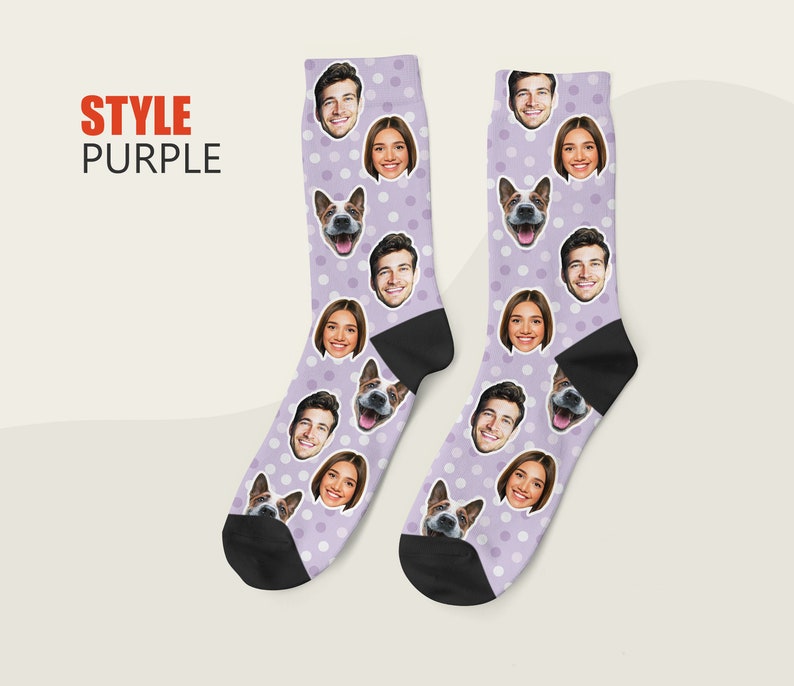 May include: A pair of purple socks with white polka dots. The socks feature a repeating pattern of faces, including a dog, a man, and a woman.