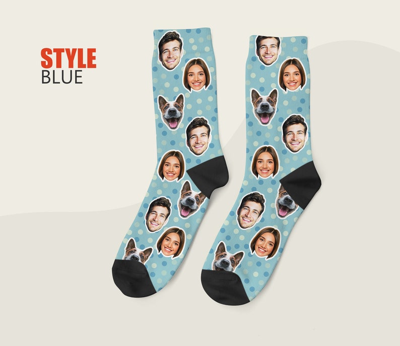 May include: A pair of blue socks with white polka dots and a repeating pattern of faces and a dog's face. The socks are made of a soft, comfortable material and are perfect for everyday wear.