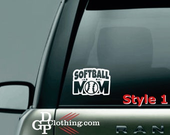 May include: A black and white decal with the text "Softball Mom" and a baseball graphic. The decal is on a car window with the text "Style 1" below it.