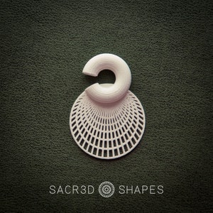 May include: A white, 3D-printed earring with a geometric design. The earring features a circular top and a circular, openwork bottom. The text "SACR3D SHAPES" is printed at the bottom of the image.