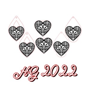 May include: Five black and white heart-shaped ornaments with a bird and floral design. The ornaments have a hole at the top for hanging. The text "HG 2022" is written in red below the ornaments.