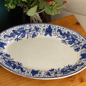 May include: A set of three ceramic mugs with a speckled, matte finish. The mugs are in shades of cream, light gray, and dark gray. Each mug has a simple, minimalist design, perfect for coffee or tea.