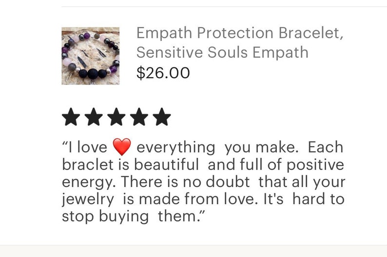 May include: A purple, black and grey beaded bracelet with a heart charm. The bracelet is described as an "Empath Protection Bracelet" and is priced at &pound;26.00. The product has a five-star rating and a customer review that says "I love everything you make. Each bracelet is beautiful and full of positive energy. There is no doubt that all your jewellery is made from love. It's hard to stop buying them."