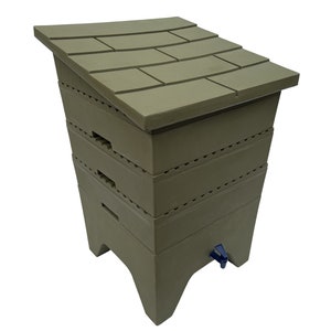 May include: A green plastic compost bin with a hinged lid and a spout for draining liquid. The bin is made of three stacked sections.