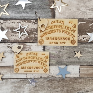 Mini tabla ouija de bolsillo y planchette
