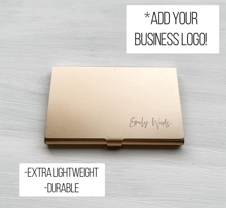 May include: Gold metal business card holder with the text "Emily Woods" engraved on the front. The card holder is lightweight and durable.