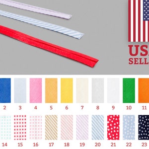 May include: A selection of 24 different colors and patterns of 1-inch wide elastic fold over elastic (FOE) for sewing projects. The colors include black, blue, white, pink, yellow, orange, green, and red. The patterns include polka dots, stripes, and hearts.