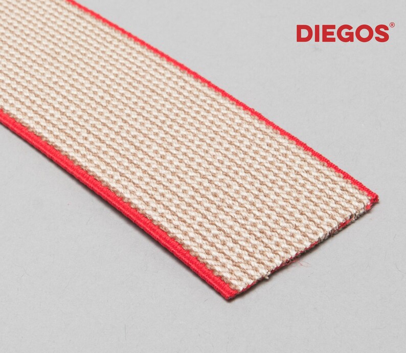 May include: A close-up of a beige elastic band with a red trim. The band is woven with a textured pattern. The text "DIEGOS&reg;" is visible in the upper right corner of the image.