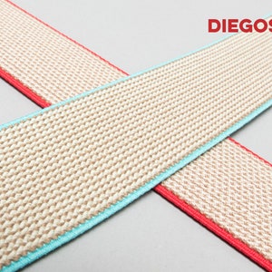 May include: Two beige elastic bands with contrasting trim. One band has a turquoise trim and the other has a red trim. The text "DIEGOS&reg;" is printed in red on the top right corner of the image.
