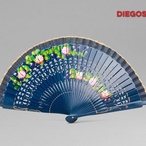 May include: A blue hand fan with a gold trim and floral designs. The fan is made of wood and has a delicate, intricate design.