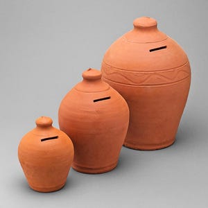 May include: Three terracotta piggy banks of varying sizes. Each bank has a slot for inserting coins and a rounded shape. The largest bank features a decorative band around its midsection. The banks are arranged in a row, showcasing their different dimensions.