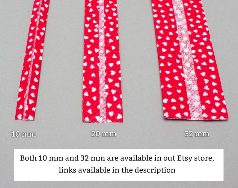 May include: Three red fabric strips with white heart patterns. The strips are 10 mm, 20 mm, and 32 mm wide. Both 10 mm and 32 mm are available in our Etsy store, links available in the description.