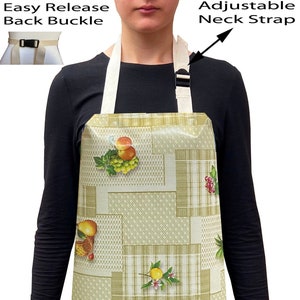 May include: A green and white checked apron with a fruit and floral design. The apron has adjustable neck straps and an easy release back buckle.