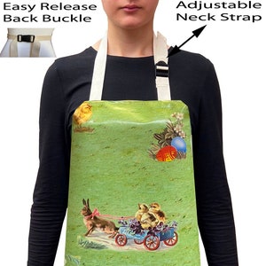 May include: A green apron with an Easter theme featuring a rooster, chicks, a bunny, and Easter eggs. The apron has adjustable neck straps and an easy release back buckle.