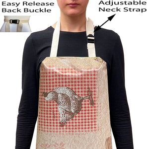 May include: A brown and white apron with a red and white checked pattern and a chicken design. The apron has an adjustable neck strap and an easy release back buckle.