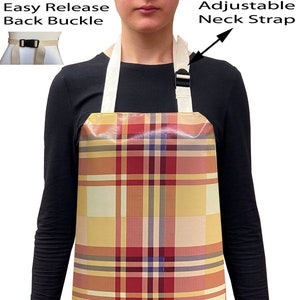 May include: A yellow, red and pink plaid apron with adjustable neck straps and an easy release buckle. The apron is made of waterproof material.