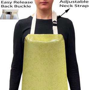 May include: A light green waterproof apron with adjustable neck straps and an easy release back buckle.