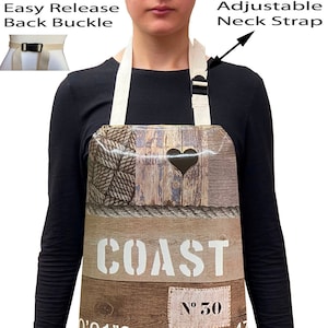 May include: A brown and beige apron with a nautical theme. It features a wooden plank design with the word "COAST" printed in white. The apron has adjustable straps and a back buckle. The apron also has a heart design and the text "N° 30" and "MAX 40781KG".