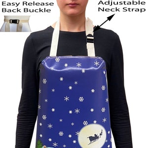 May include: A blue waterproof apron featuring a winter scene with snowmen, houses, and a sleigh pulled by reindeer. The apron has an adjustable neck strap and an easy release back buckle.