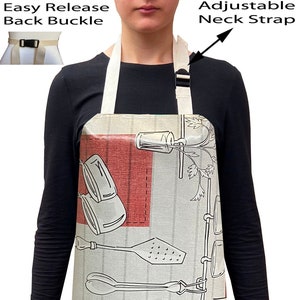 May include: A beige and red patterned apron with adjustable neck straps and an easy release back buckle. The apron features a design of kitchen utensils and jars.