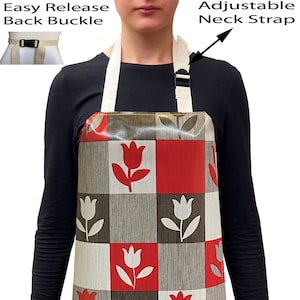 May include: A red and white checked apron with a tulip pattern. The apron has an adjustable neck strap and an easy release back buckle.