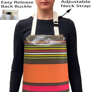 May include: A colourful striped and polka dot waterproof apron with an adjustable neck strap and an easy release back buckle.