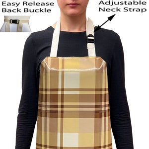 May include: A brown and beige plaid apron with adjustable neck straps and an easy release back buckle.