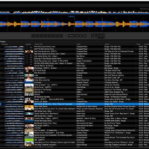 May include: A computer screen displaying a DJ software interface. The software shows a waveform at the top, a track list, and various controls. The interface is primarily black with blue and yellow accents.
