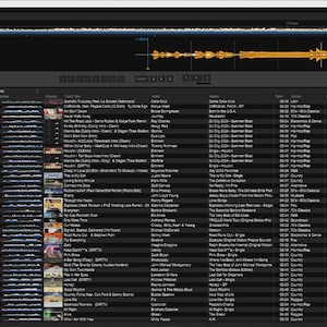 May include: A digital audio workstation interface displaying a dark theme with a waveform visualization at the top and a detailed music library list below. The software features columns for track title, artist, album, duration, genre, key, and date.