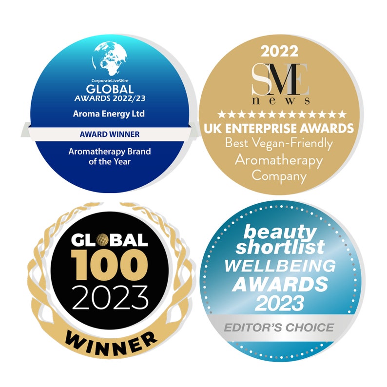 May include: Four circular awards with gold and blue accents. The awards are for "Global Awards 2022/23", "UK Enterprise Awards 2022", "Global 100 2023", and "Beauty Shortlist Wellbeing Awards 2023".