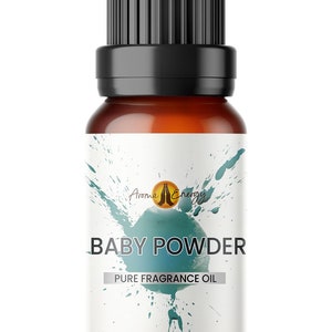 May include: A brown glass bottle with a black cap and a white label. The label has a green and blue watercolor design and the text "Aroma Energy" and "BABY POWDER PURE FRAGRANCE OIL".