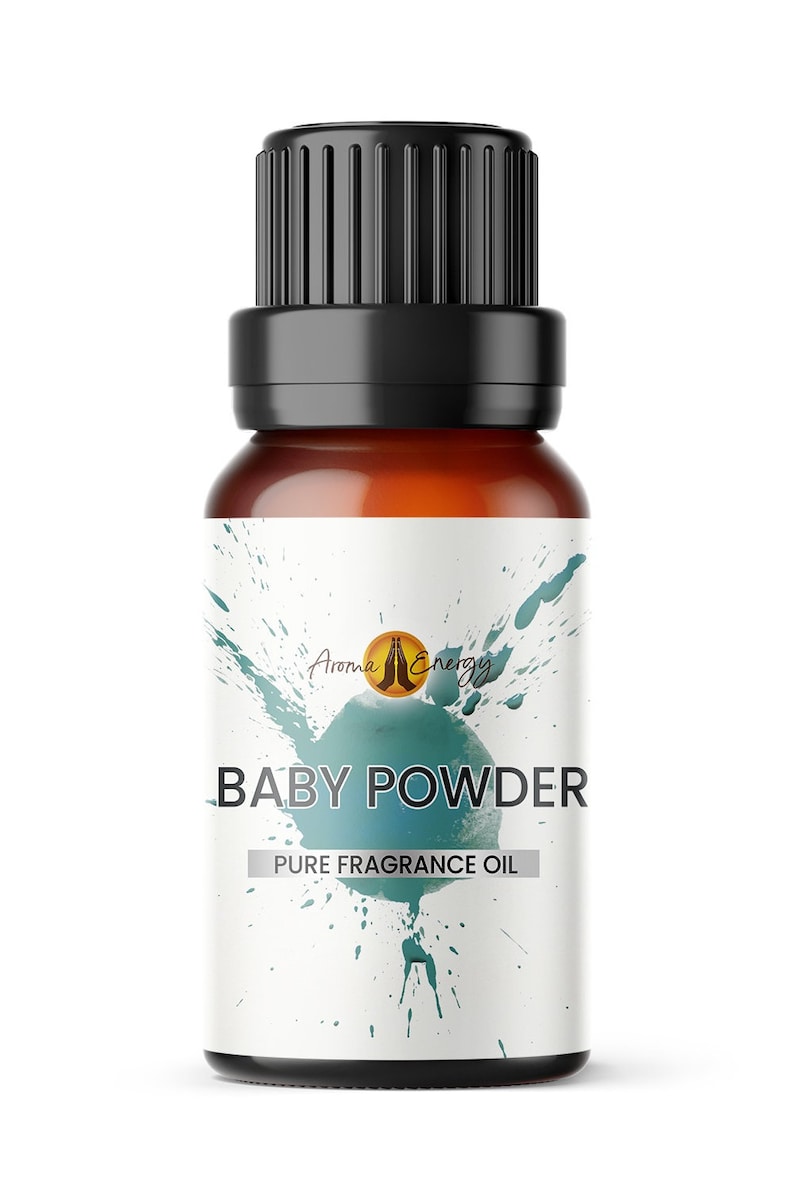 May include: A brown glass bottle with a black cap and a white label. The label has a green and blue watercolor design and the text "Aroma Energy" and "BABY POWDER PURE FRAGRANCE OIL".
