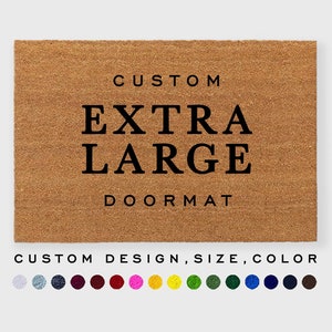 May include: A brown coir doormat with the text "CUSTOM EXTRA LARGE DOORMAT" in black lettering. The doormat is customizable with different designs, sizes, and colors. A color palette of 12 colors is shown below the doormat.