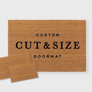 May include: A brown coir doormat with the text "CUSTOM CUT & SIZE DOORMAT" printed in black.