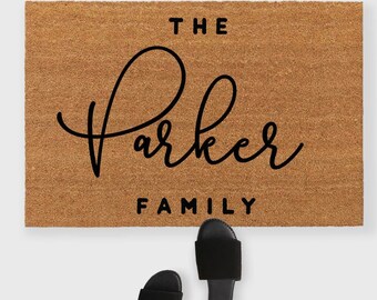 May include: A brown coir doormat with the text "The Parker Family" in black cursive lettering.