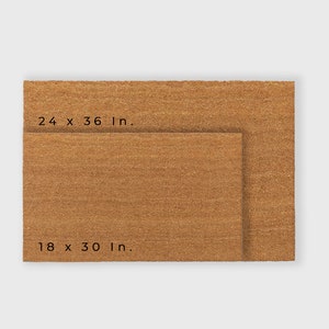 May include: Two brown coir doormats, one smaller than the other. The larger mat measures 24 x 36 inches, and the smaller mat measures 18 x 30 inches.