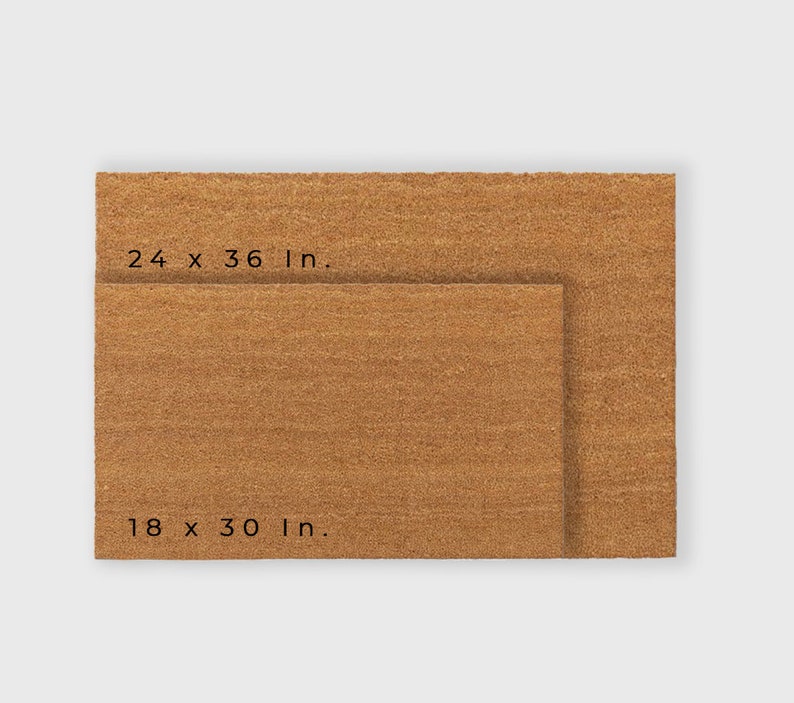 May include: Two brown coir doormats, one smaller than the other. The larger mat measures 24 x 36 inches, and the smaller mat measures 18 x 30 inches.