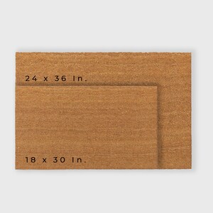 May include: Two brown coir doormats, one smaller than the other. The larger mat measures 24 x 36 inches, and the smaller mat measures 18 x 30 inches.